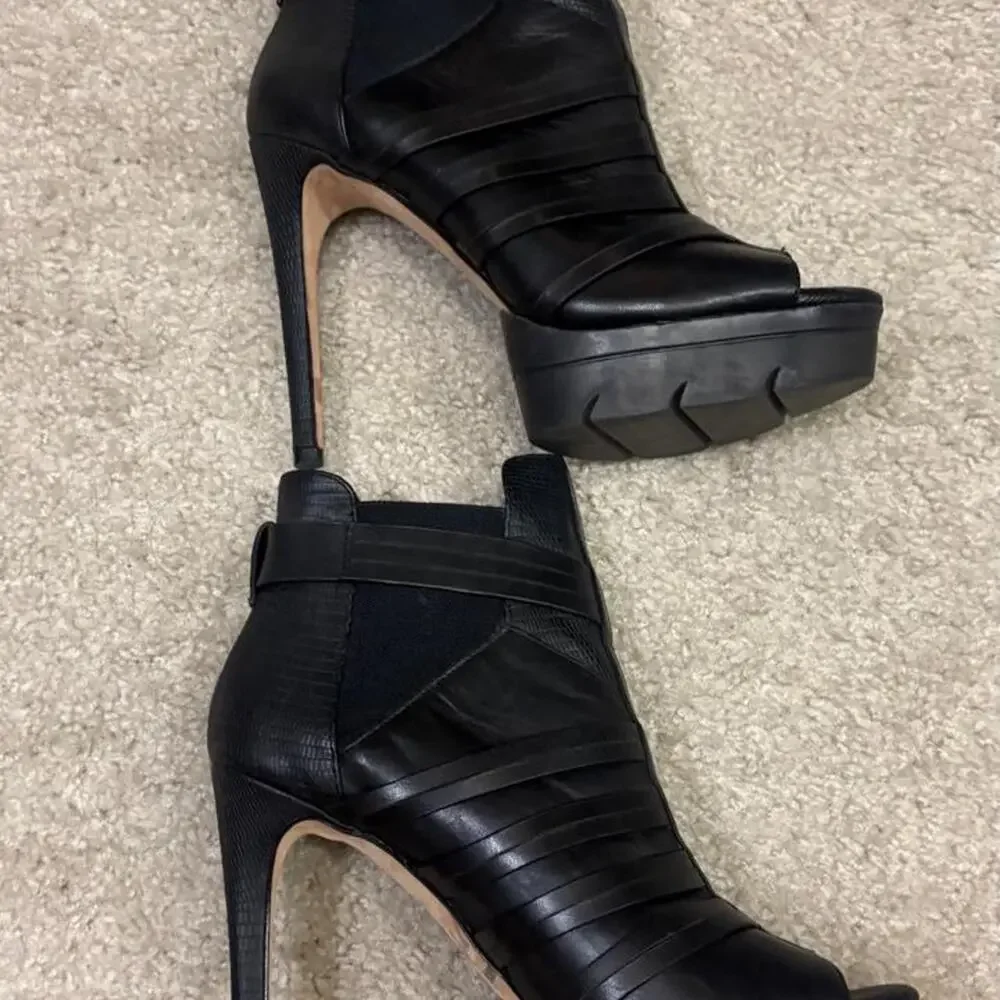 Black leather platform heels with